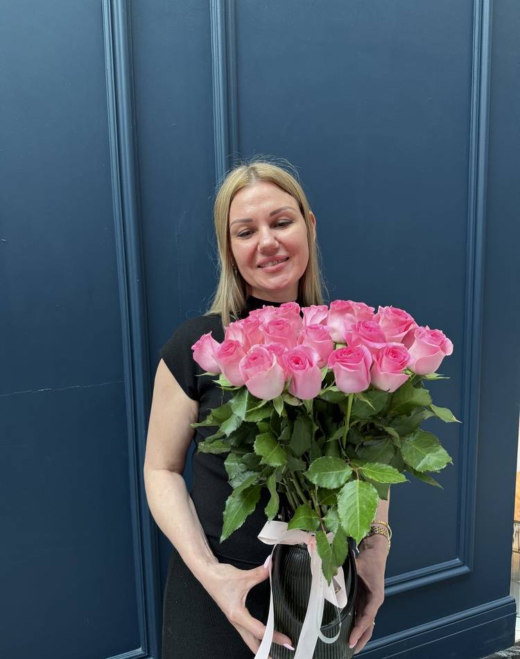 31 pink roses in a vase