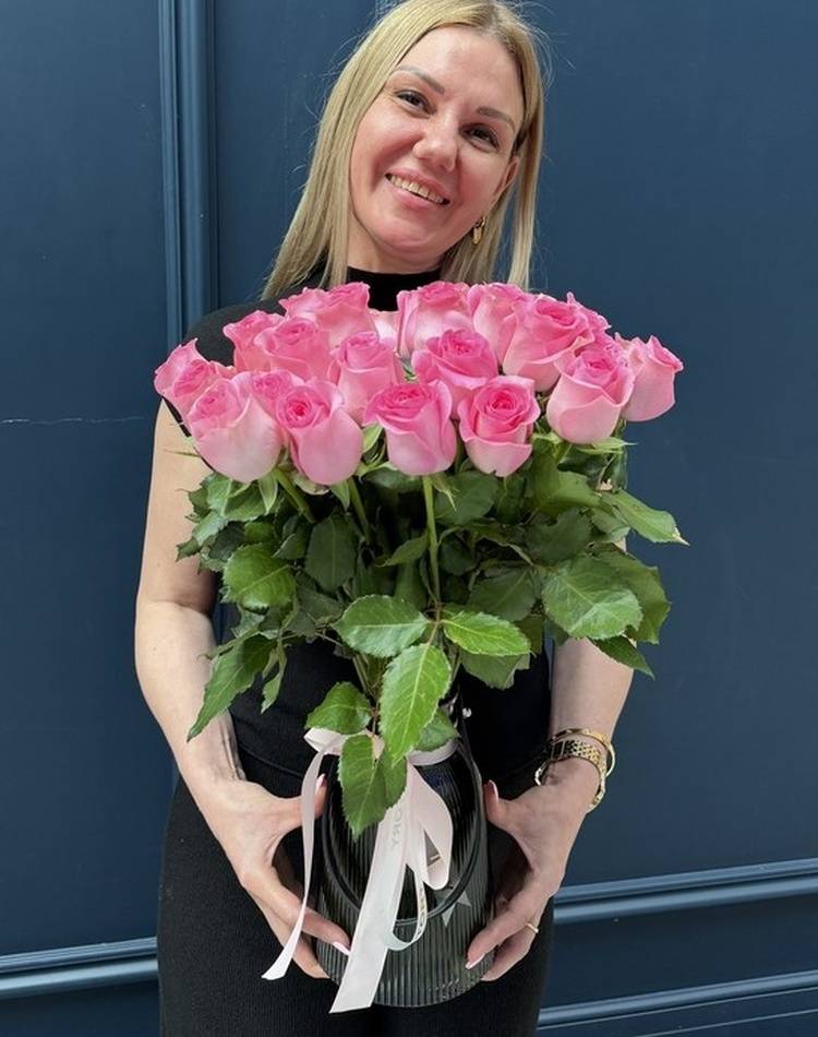 31 pink roses in a vase