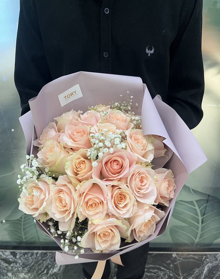 Bouquet of 21 peach Roses in packaging