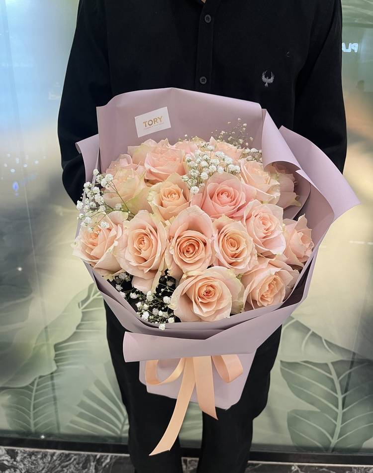 Bouquet of 21 peach Roses in packaging