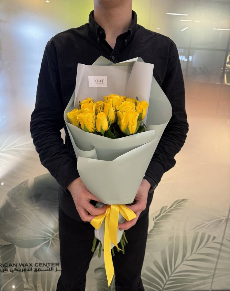 bouquet of 15 yellow roses in a packaging