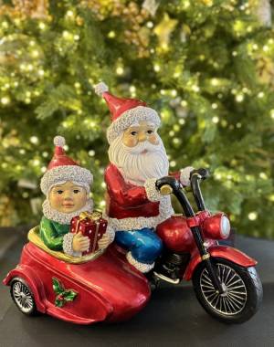 Santa and Mrs in autoette - flowers delivery Dubai