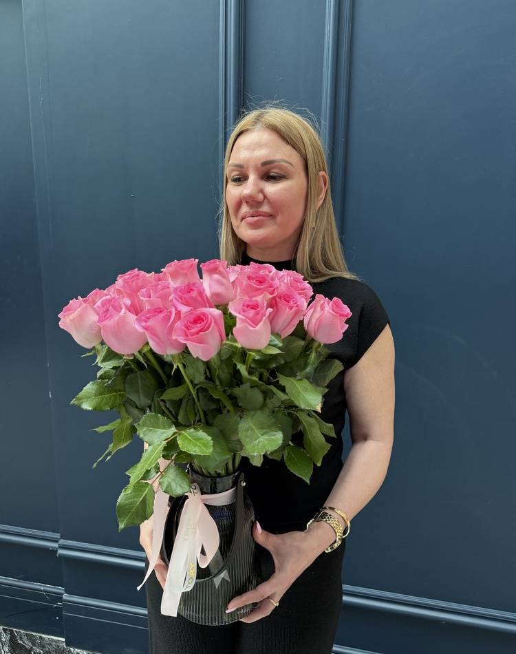 31 pink roses in a vase