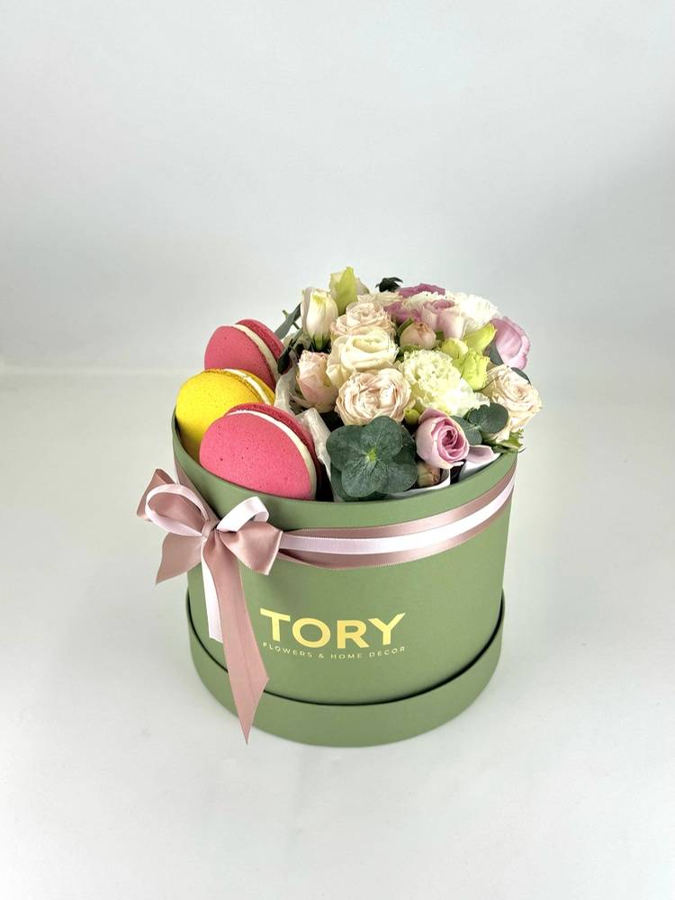 Flowers in a box with sweets 