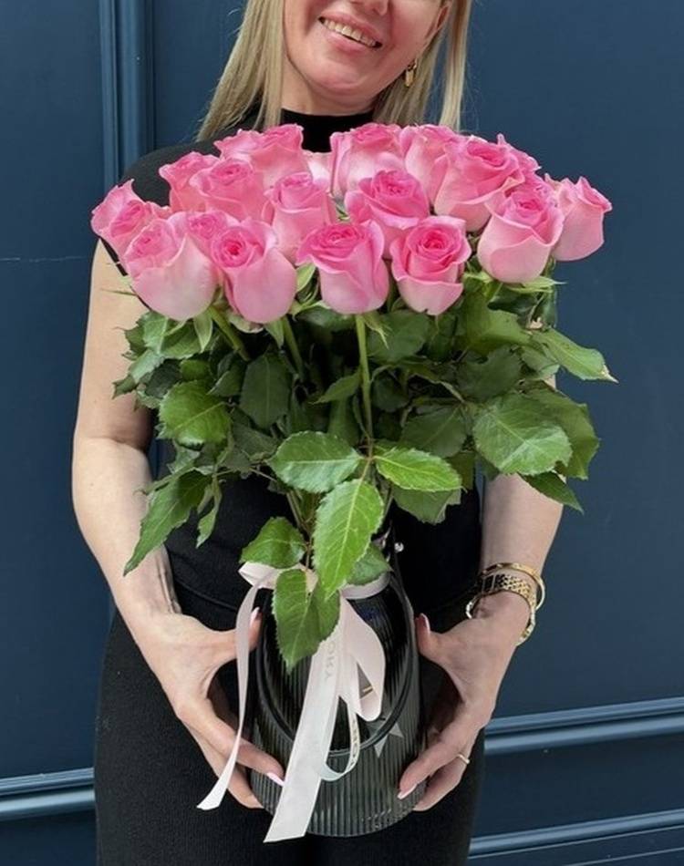 31 pink roses in a vase