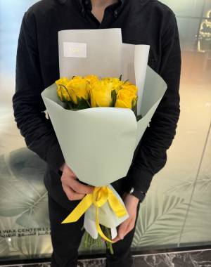 bouquet of 11 yellow roses in a packaging - flowers delivery Dubai