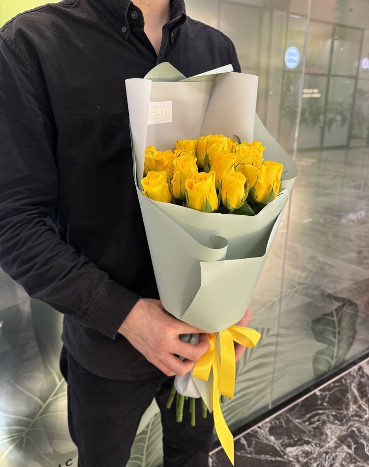 bouquet of 15 yellow roses in a packaging