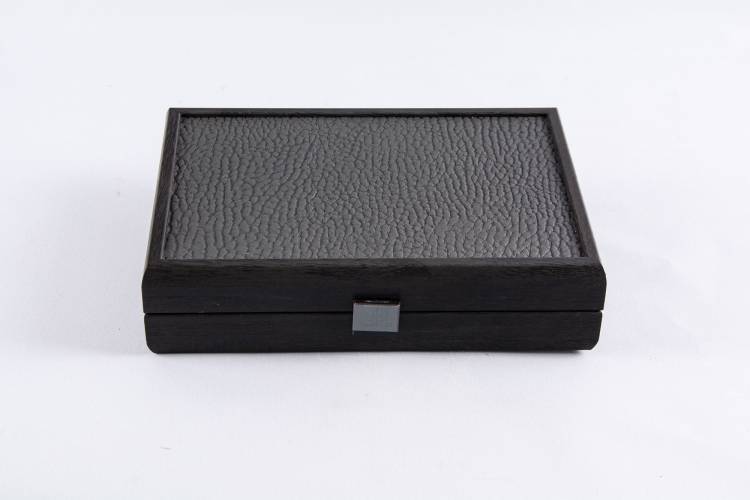 Dominoes 5.2x2.7x1cm in a wooden case made of dark gray leatherette