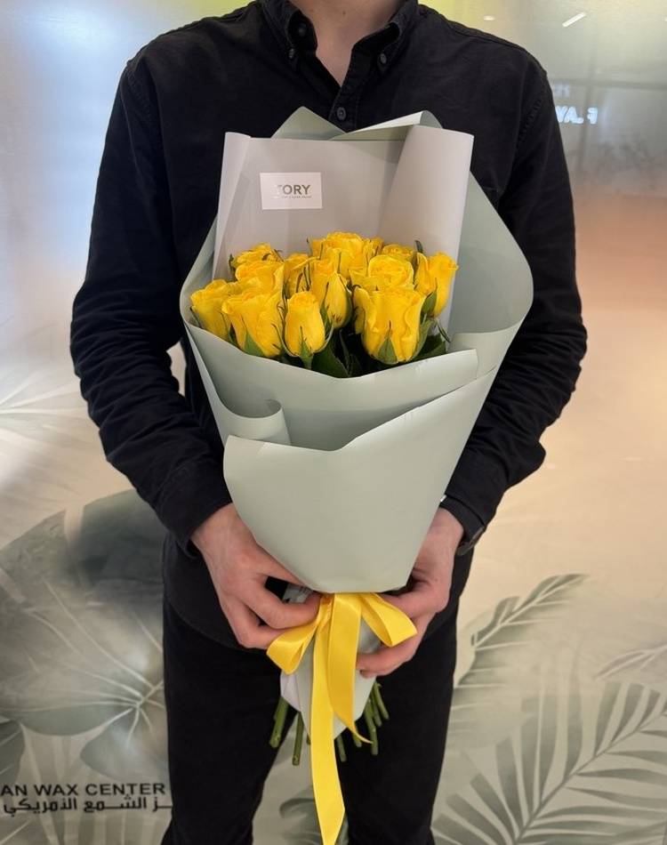 bouquet of 15 yellow roses in a packaging