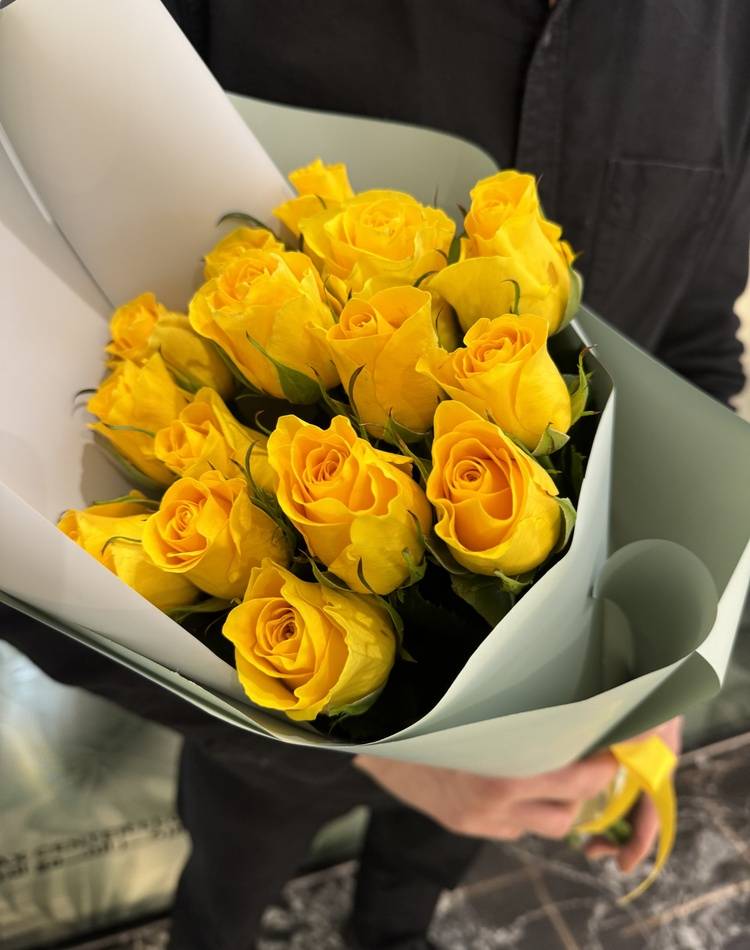 bouquet of 15 yellow roses in a packaging