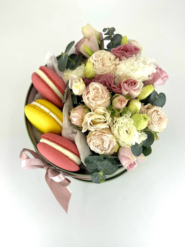 Flowers in a box with sweets 