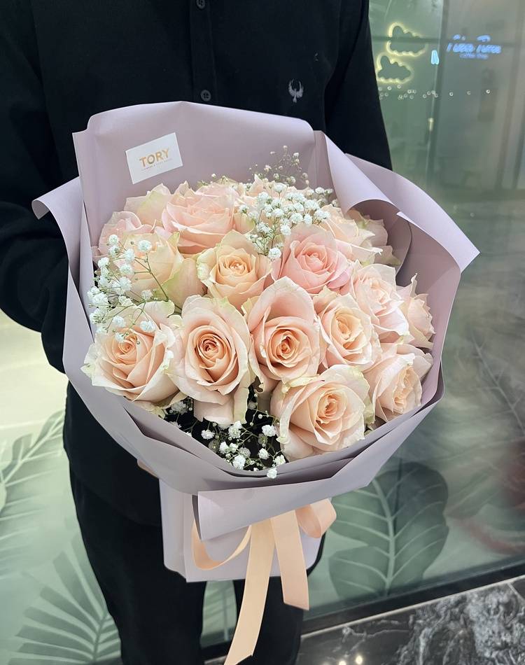 Bouquet of 21 peach Roses in packaging