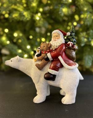 Santa sitting on polar bear poly-24,5x11,5x23cm - flowers delivery Dubai