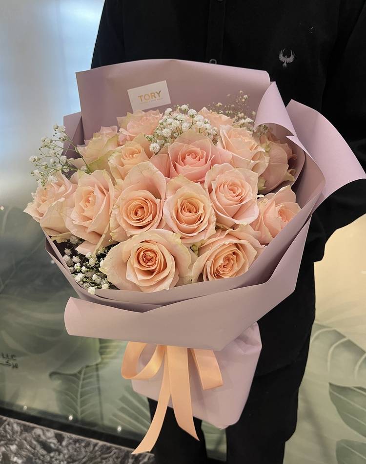 Bouquet of 21 peach Roses in packaging