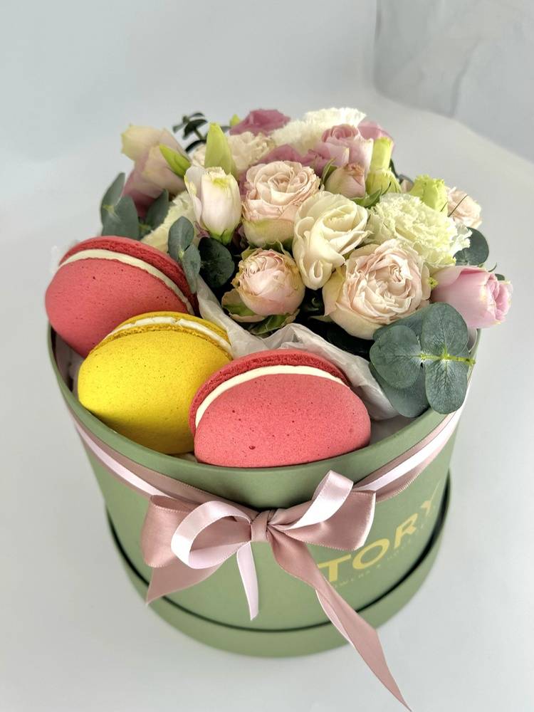 Flowers in a box with sweets 