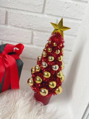 Christmas tree decorated with balls in a pot 11... - flowers delivery Dubai