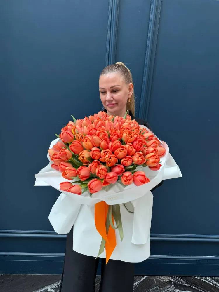 A bouquet of 101 orange peony tulips