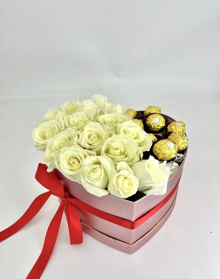 Roses in a box with sweets 